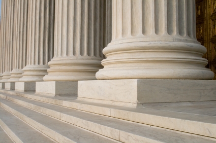 Stoic stone columns outside courthouse