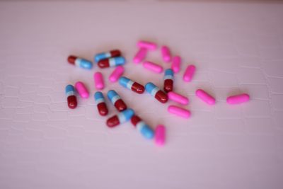 pink pills mixed with blue and red pills
